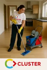 Professional cleaner in Cluster Services uniform performing end-of-lease cleaning in Adelaide kitchen